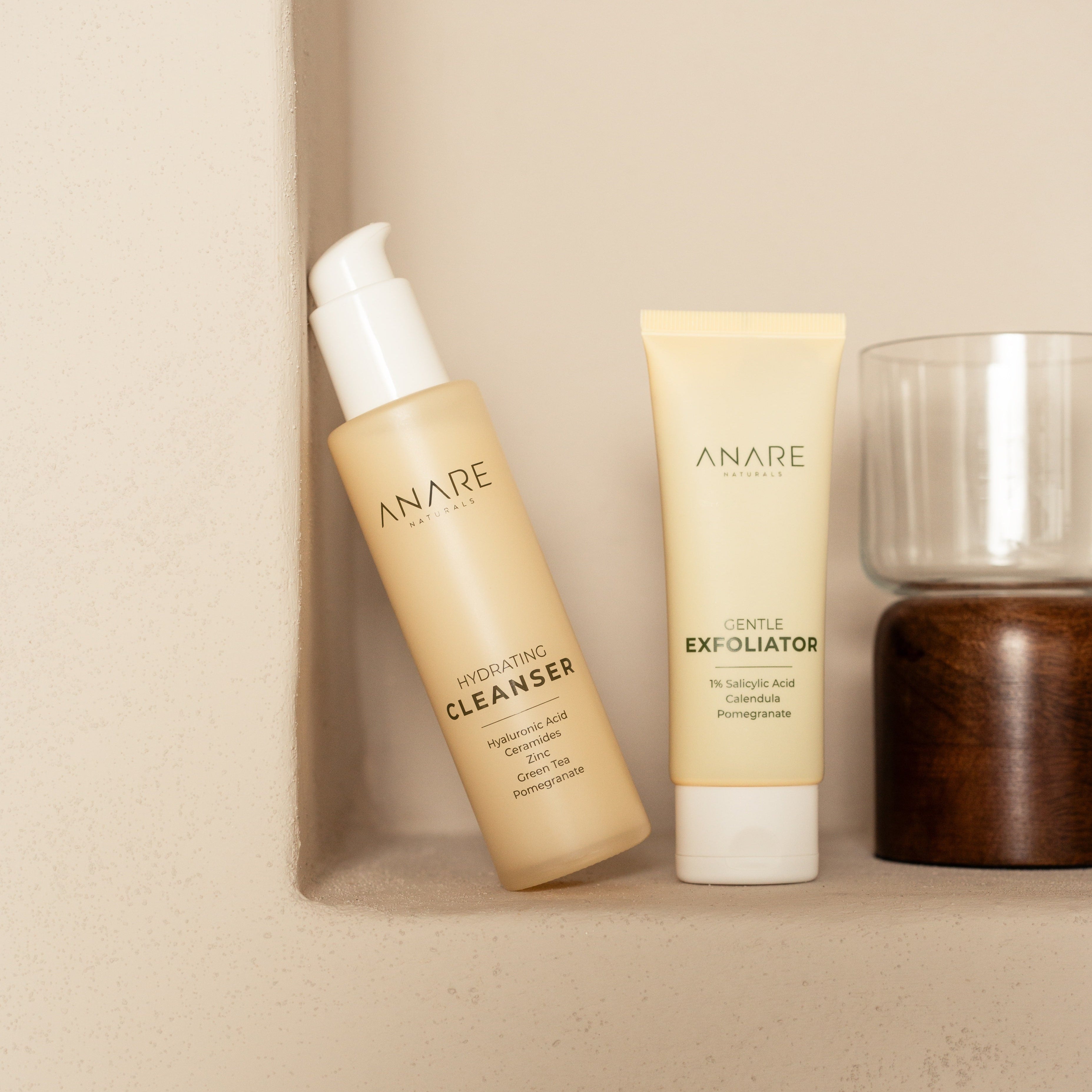 Hydrating Cleanser and Gentle Exfoliator on a shelf with a neutral background