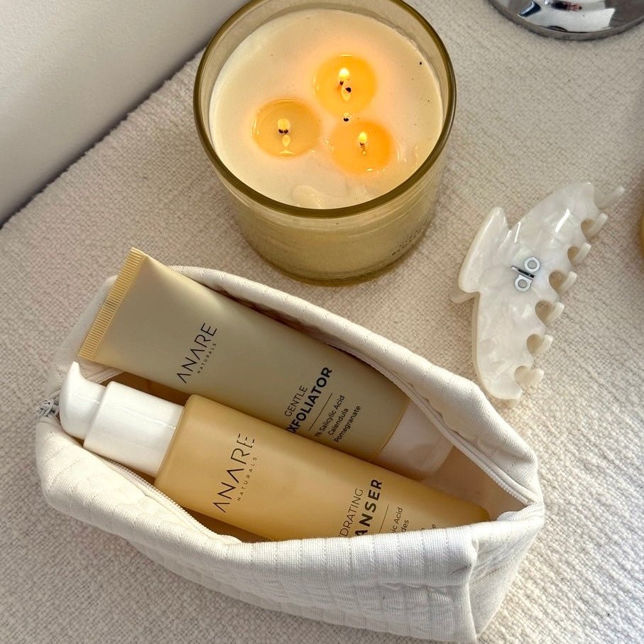 Candle and deep cleanse bundle from Anare Naturals skincare  on a textured surface